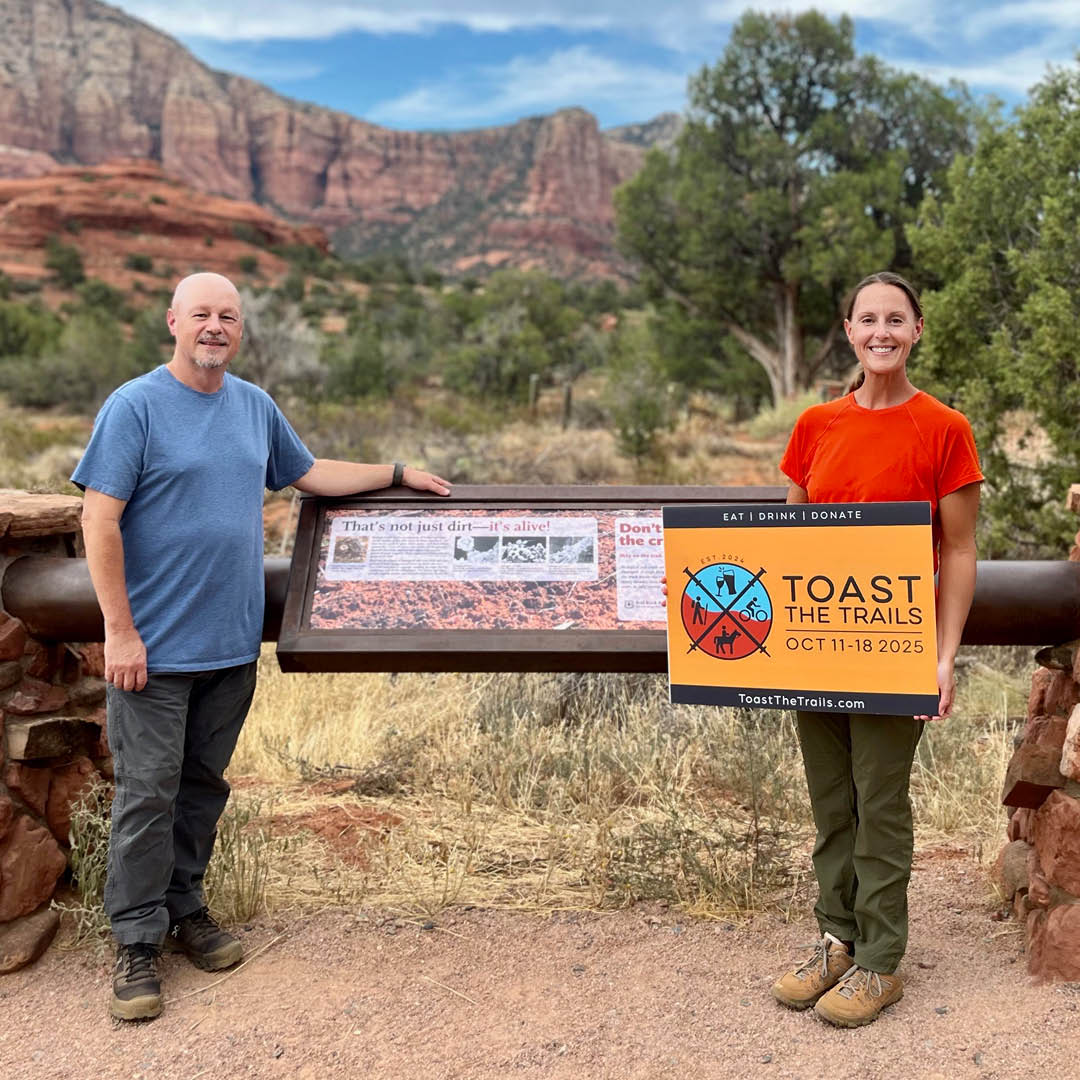Wade and Pam Winningham admire the new trail signage at Courthouse trailhead that was made possible through a $14,000 grant from POWER for Good Initiative, the charitable arm of Wade’s employer.